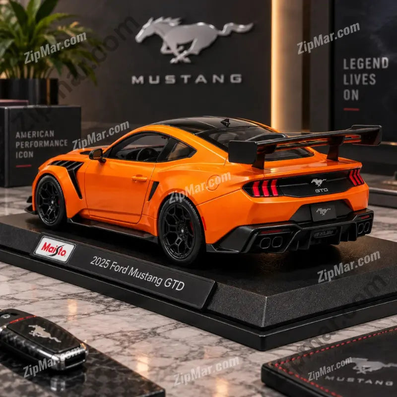 Rear view of orange Maisto Ford Mustang GTD diecast model with large rear wing and GTD badge