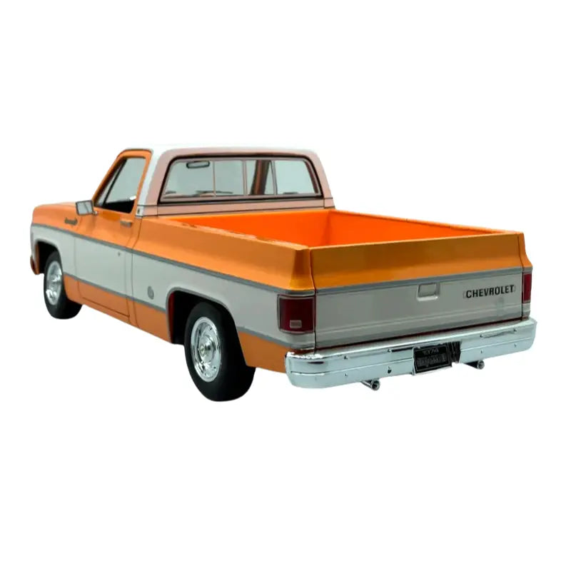 Rear three-quarter view of Maisto 1:18 1974 Chevrolet C10 Cheyenne Super orange diecast pickup truck