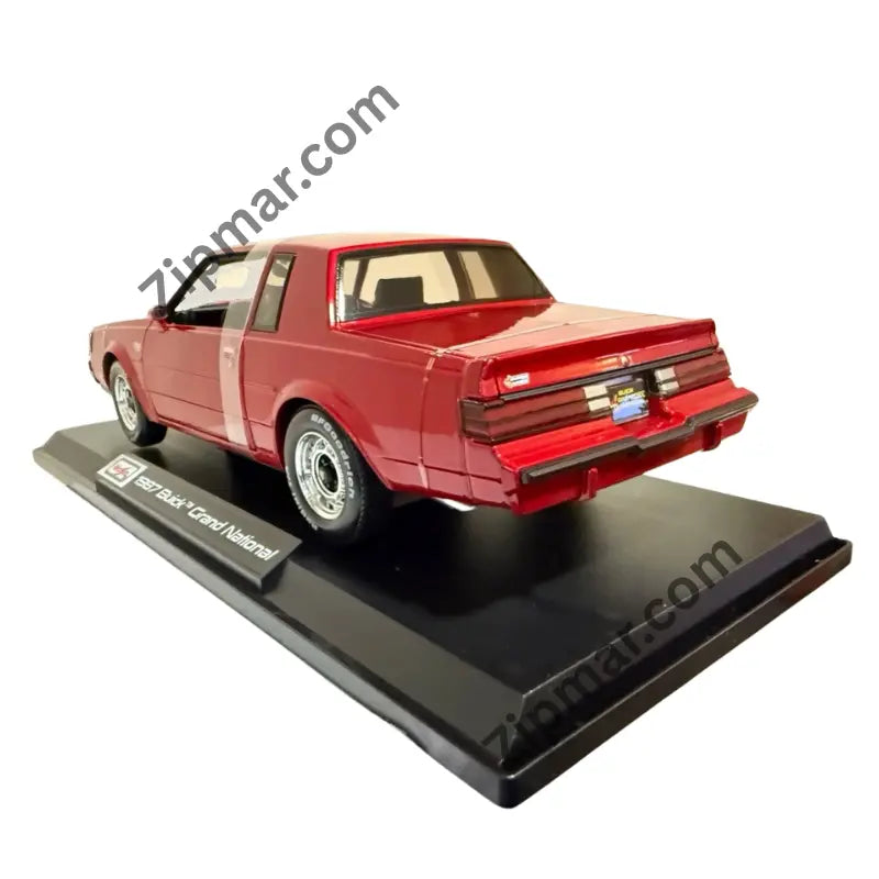 Rear three quarter view of red Maisto 1987 Buick Grand National 1:18 diecast on black display base