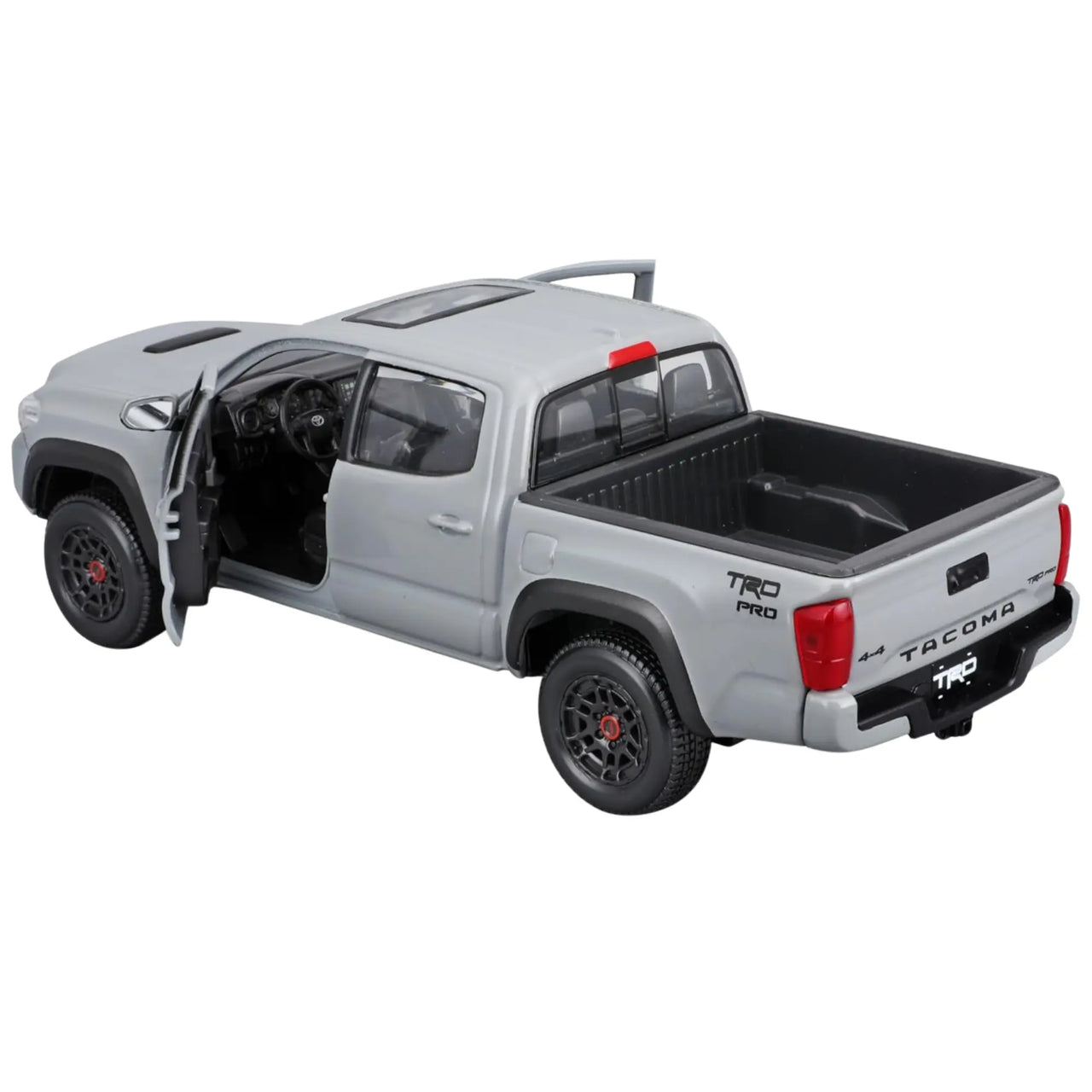 Rear angle of Maisto Tacoma TRD Pro diecast truck showing open bed and interior