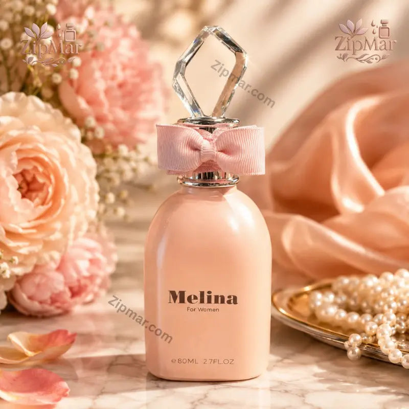 Melina for Women Eau de Parfum 80 mL peach pink bottle with bow beside roses and pearls