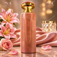 Thumbnail for Milestone Perfumes Eden Harmony Eau de Parfum round pink bottle with gold collar beside pink lilies