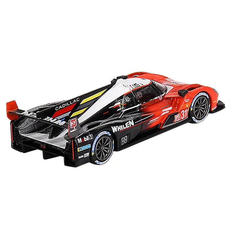 Rear perspective of Cadillac V-Series.R diecast car showing detailed aero wing and racing decals.
