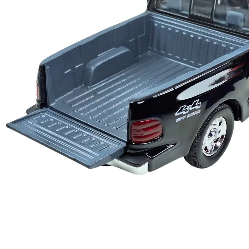 Motormax Ford F150 diecast truck with tailgate down showing bed