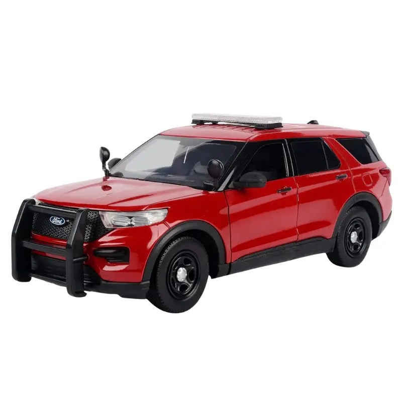Side profile of the red 2015 Ford Police Interceptor Utility Fire Marshal diecast car showing light bar and spotlight.