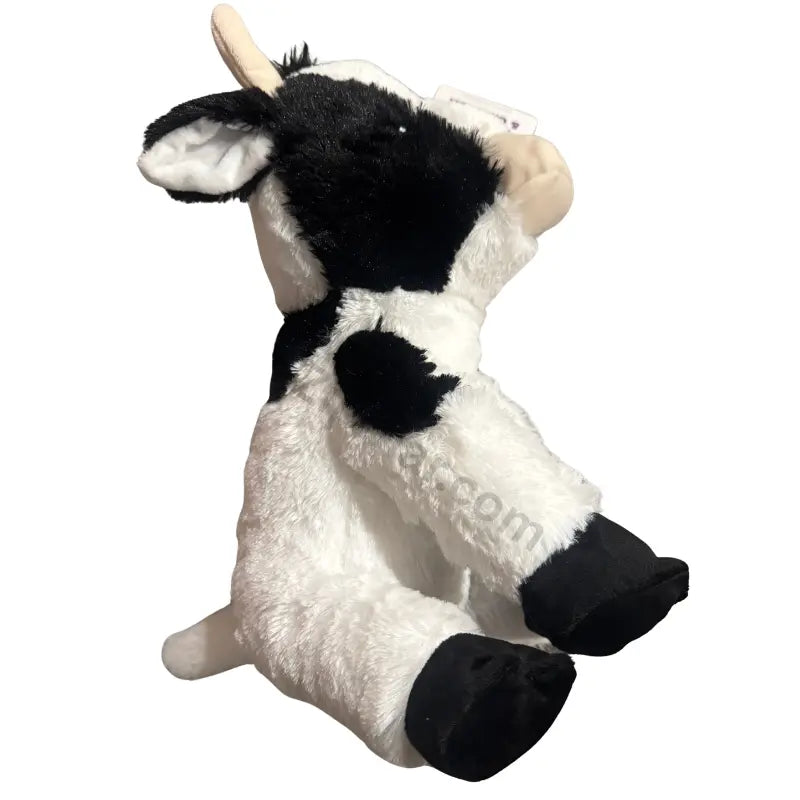 Multipet cow plush dog toy side view with black head patch, black feet and white body
