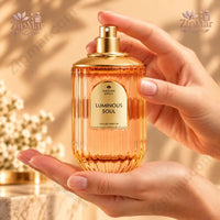 Thumbnail for Nature Spell Luminous Soul Eau de Parfum 100 mL gold ribbed bottle held in hands