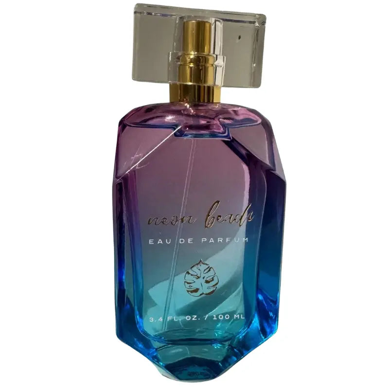 Close up of the gold atomizer and clear cap of the Neon Beach Eau De Parfum.