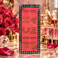 Thumbnail for Side of Nicki Minaj Minajesty box with gold foil Nicki Minaj lettering on a red panel and a black border
