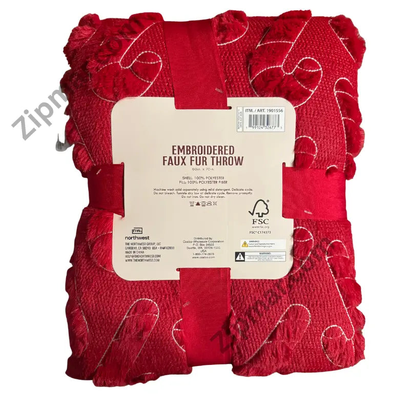 Northwest embroidered faux fur throw red candy cane package back label with size, fabric content and care instructions”
