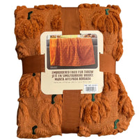 Thumbnail for Front packaged view of The Northwest Group Halloween pumpkin embroidered faux fur throw blanket with ribbon
