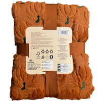 Thumbnail for Back label view of The Northwest Group pumpkin throw blanket showing Costco item number 1901555, care instructions, and material specifications