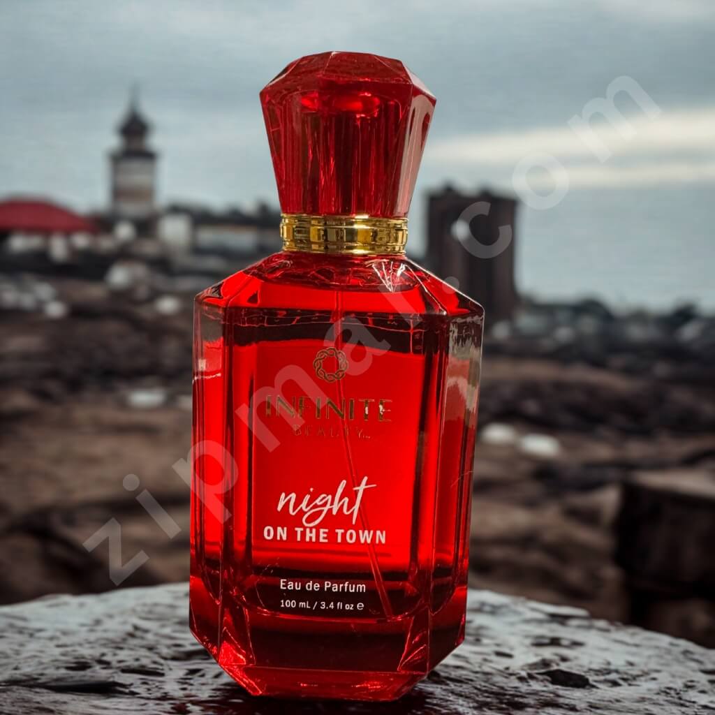 Red perfume bottle labeled 'night on the town' with a blurred background