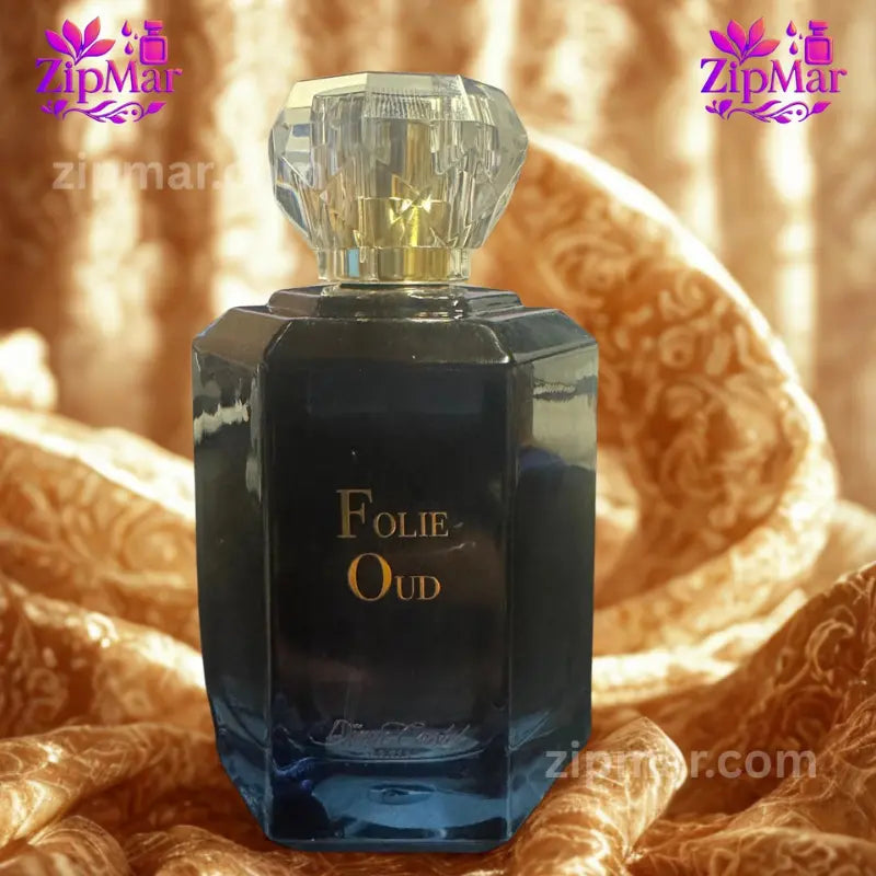 Parfums Diane Castel Folie Oud EDP bottle presented on draped gold fabric