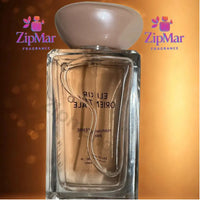 Thumbnail for Back view of Parfums Terre Paris Elixir Orientale Eau de Parfum bottle through the glass with wavy line and stone shaped cap