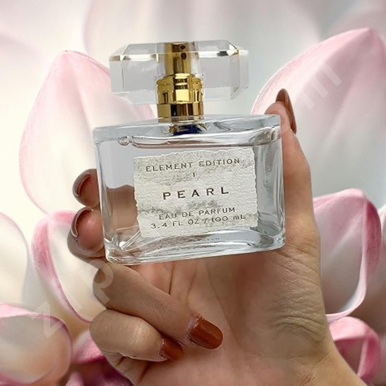 PEARL perfume 3.4oz with crystal cap and gold sprayer hand view