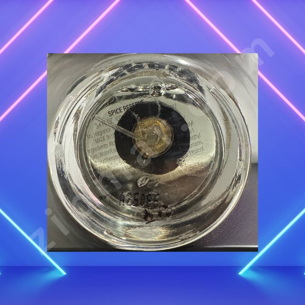 Clear glass spice jar lid with visible branding on a blue and pink gradient background bottom