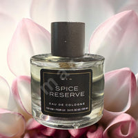 Thumbnail for Spice Reserve cologne bottle with pink flowers in the background