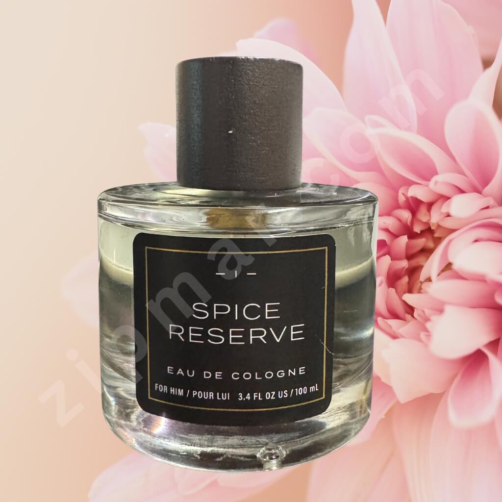 Spice Reserve cologne bottle with a pink flower in the background long lasting