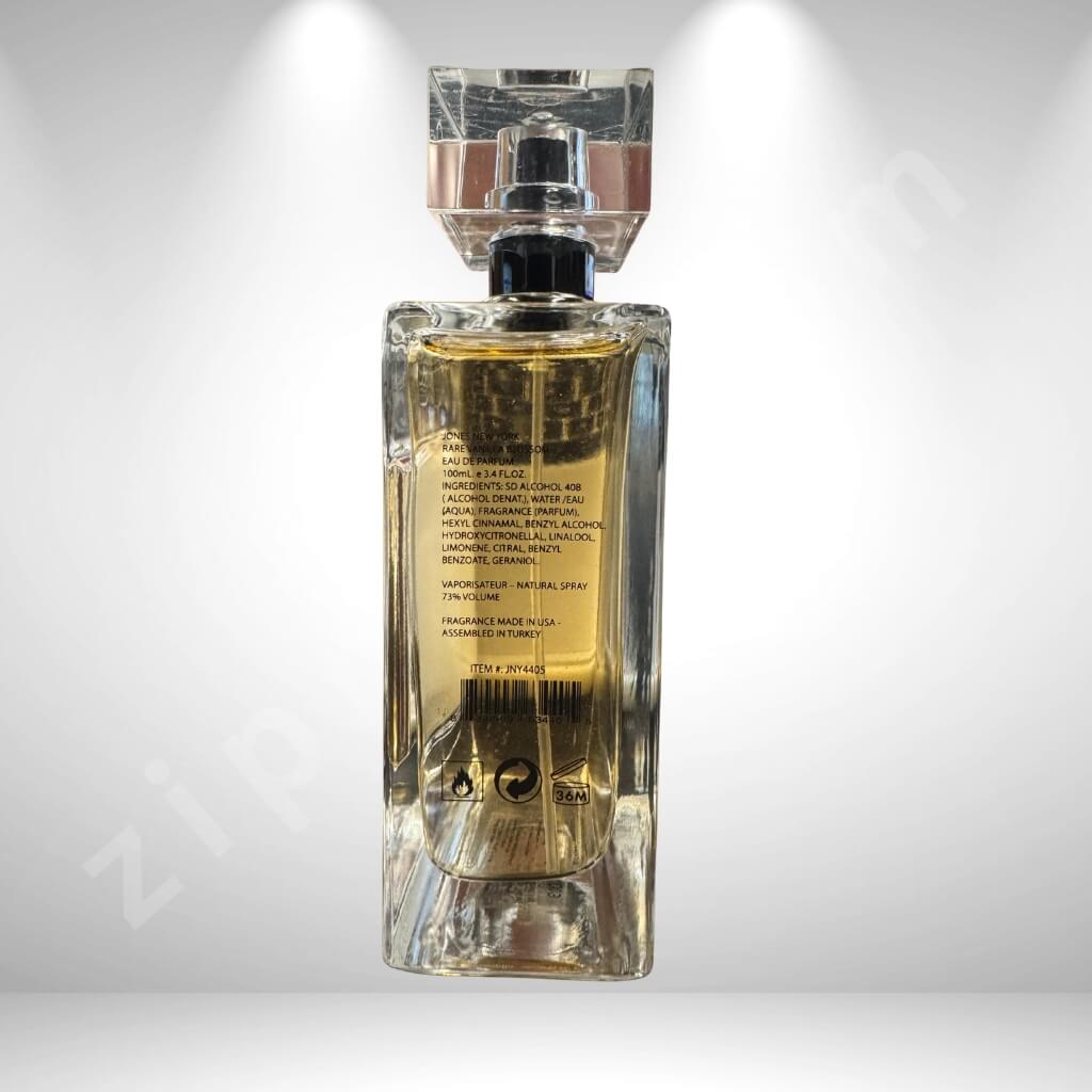 Perfume bottle with gold liquid on a white background “Rare Vanilla Blossom perfume 3.4oz crystal cap clear rectangular bottle