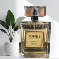 Thumbnail for Perfume bottle labeled 'Jones New York Signature Rare Vanilla Blossom' with a plant in the background.Women’s vanilla floral fragrance by Jones New York EDP 100m