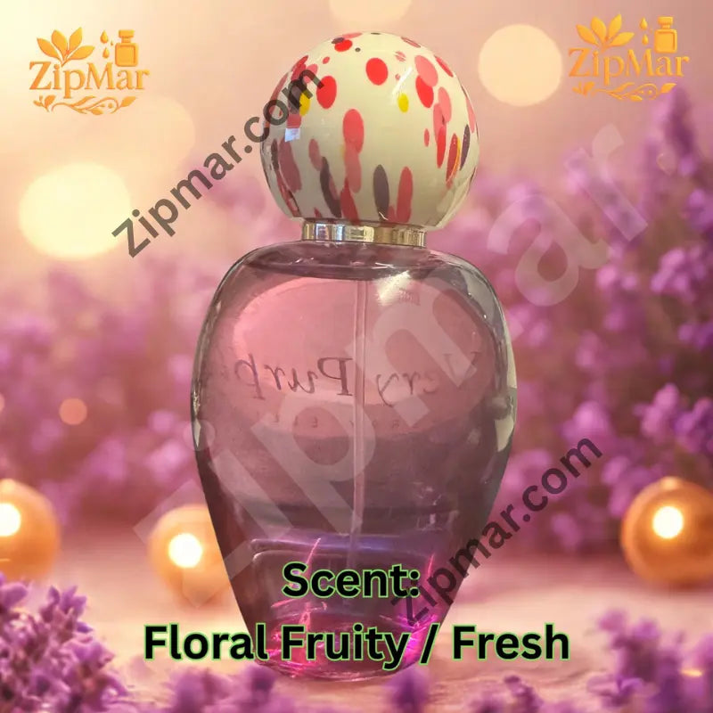 Perry Ellis Very Purple for women rounded purple glass perfume bottle with cream dotted ball cap on a lavender background