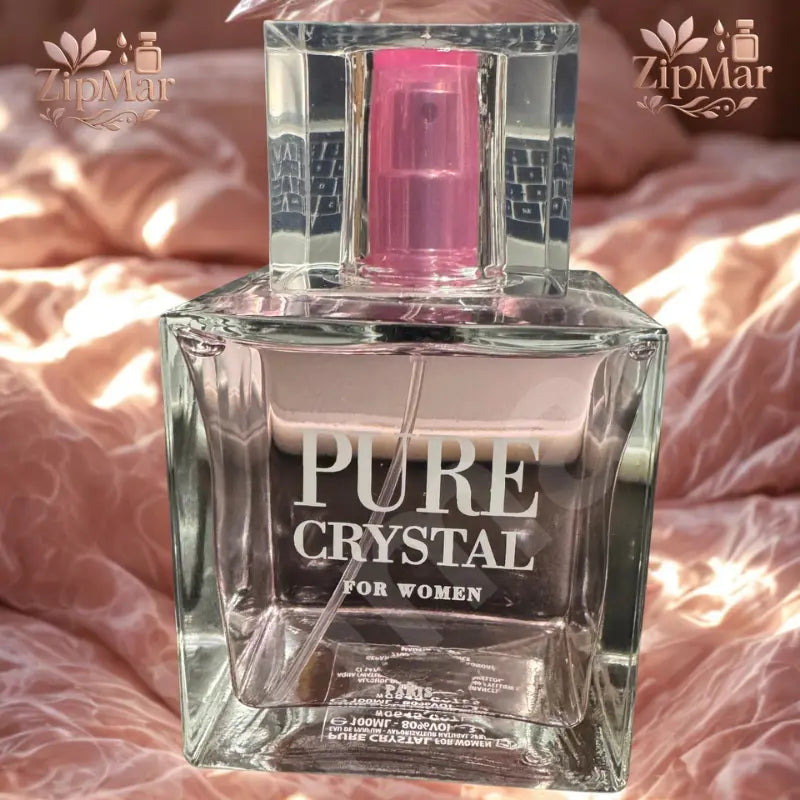 Pure Crystal for Women Eau de Parfum square glass bottle with pink spray pump on pink bedding