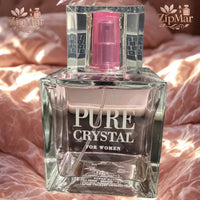 Thumbnail for Pure Crystal for Women Eau de Parfum square glass bottle with pink spray pump on pink bedding