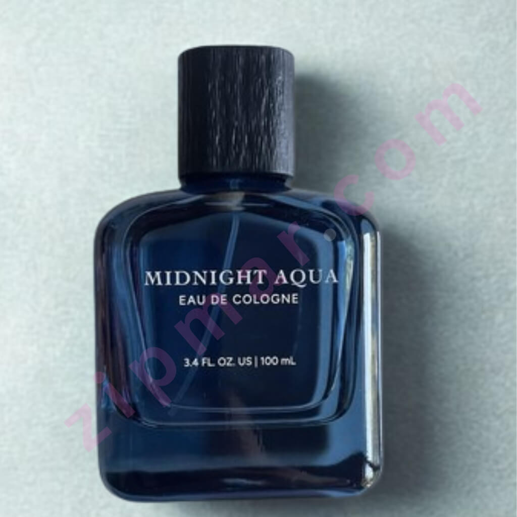 Perfume bottle labeled 'Midnight Aqua Eau de Cologne' on a light gray background