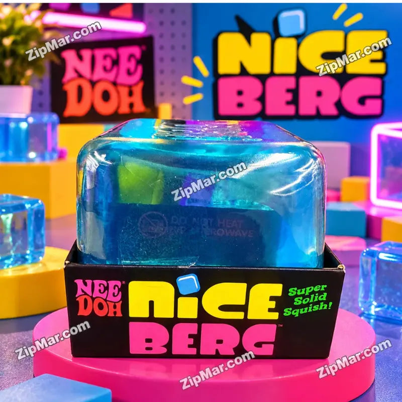 Schylling NeeDoh Nice Berg translucent blue iceberg squish toy displayed in box on a pink display pedestal