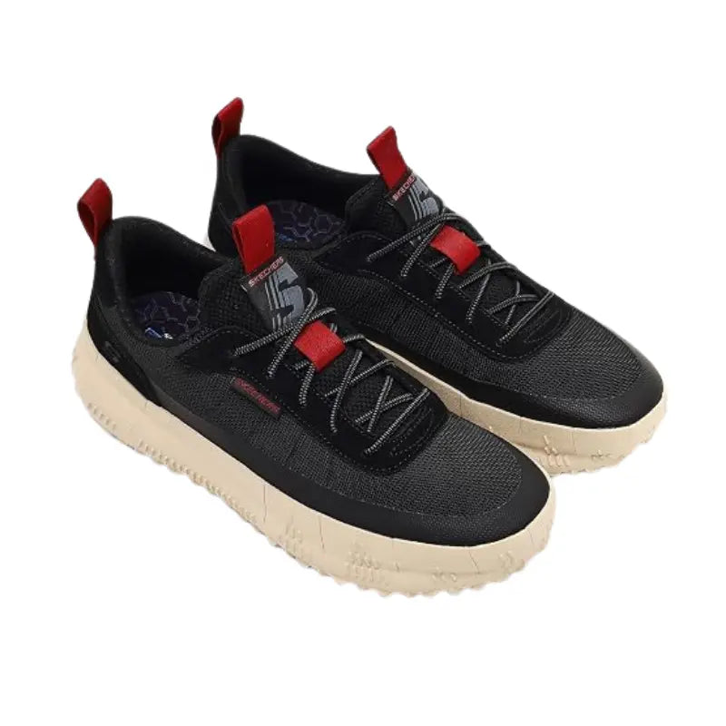 Angled perspective view of Skechers Classic Fit men's black sneakers with red accents