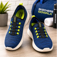 Thumbnail for Skechers GO WALK Air-Cooled Goga Mat men's blue and lime green slip-on shoes staged with gym bag