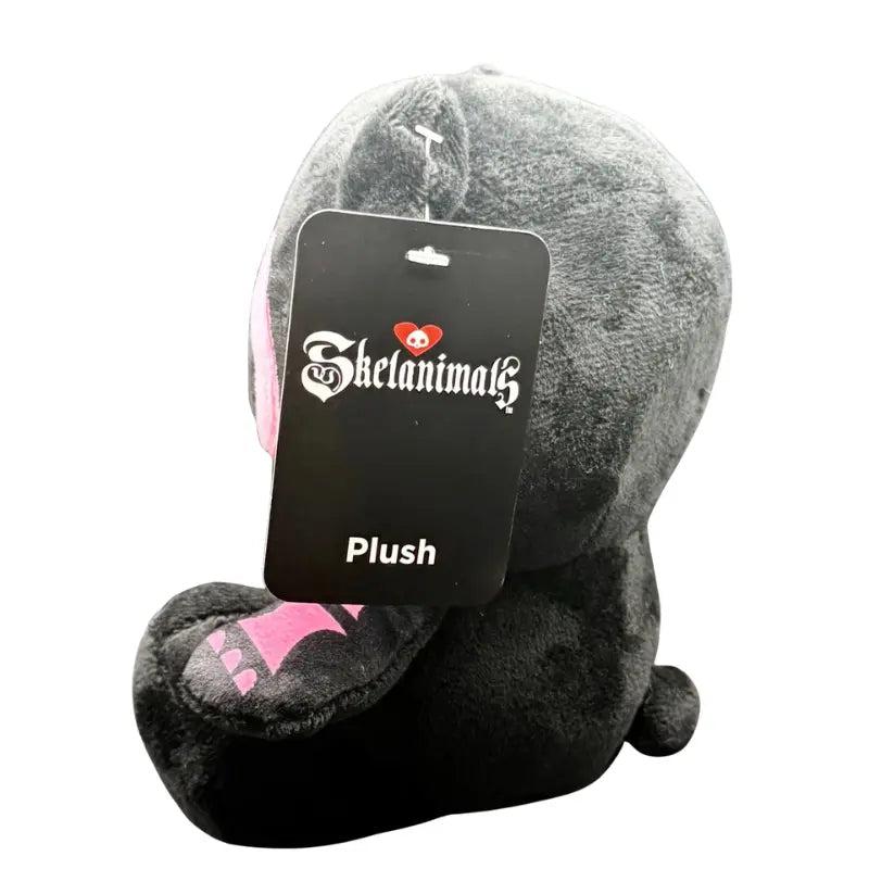 Skelanimals Pink Diego the Bat plush side profile view showing Skelanimals hang tag