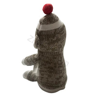 Thumbnail for Sock monkey plush toy side and back view in marled brown knit with a red pom pom and a hang tag