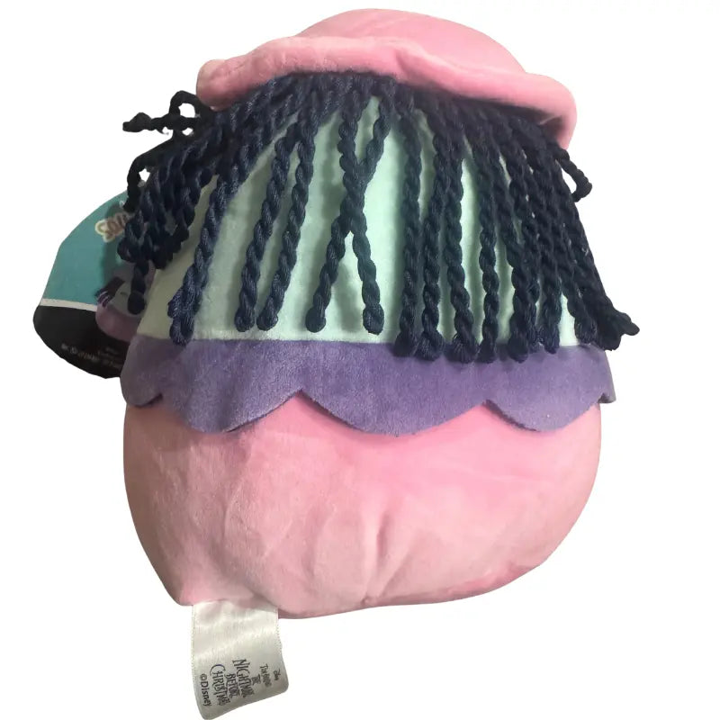 Back view of Shock Squishmallows plush showing yarn hair and Disney tag
