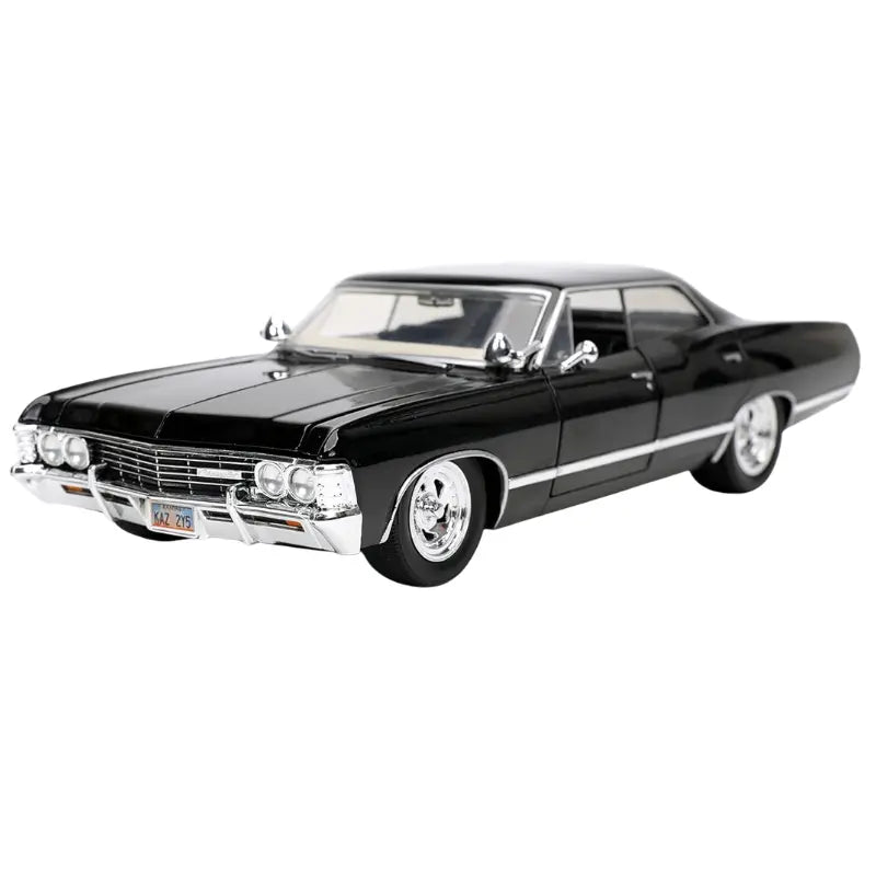 Front three-quarter view of the black 1967 Chevrolet Impala 1:24 scale diecast car with chrome wheels.