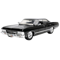 Thumbnail for Front three-quarter view of the black 1967 Chevrolet Impala 1:24 scale diecast car with chrome wheels.
