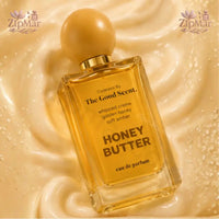 Thumbnail for Front view of Honey Butter Eau de Parfum bottle on marble surface with honeycomb accent