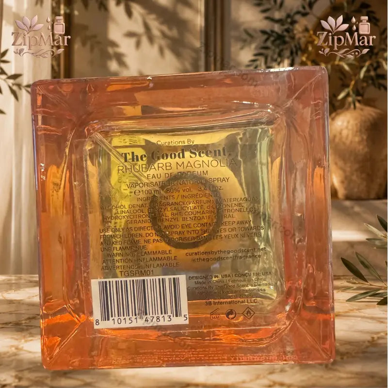 Front view of Curations By The Good Scent Rhubarb Magnolia Eau de Parfum bottle with round wooden cap
