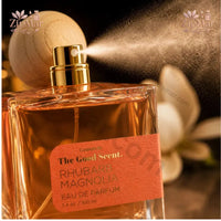 Thumbnail for Rhubarb Magnolia Eau de Parfum bottle styled alongside raw rhubarb and white magnolia blooms