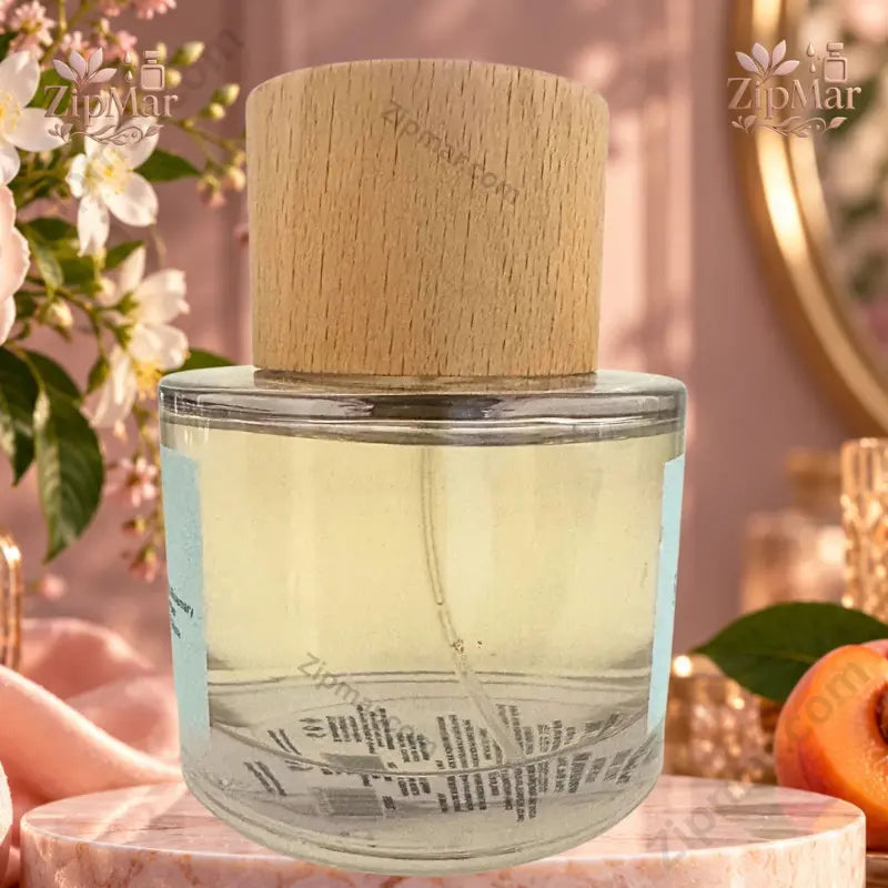 The Good Scent Spell Bound 100 mL Eau de Parfum cylindrical glass bottle with wooden cap side angle showing golden fragrance