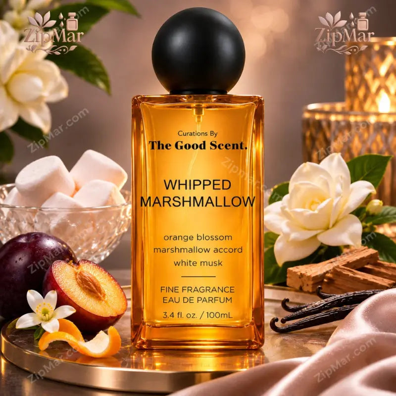 The Good Scent Whipped Marshmallow Eau de Parfum bottle with black cap beside gardenia, plum and vanilla beans
