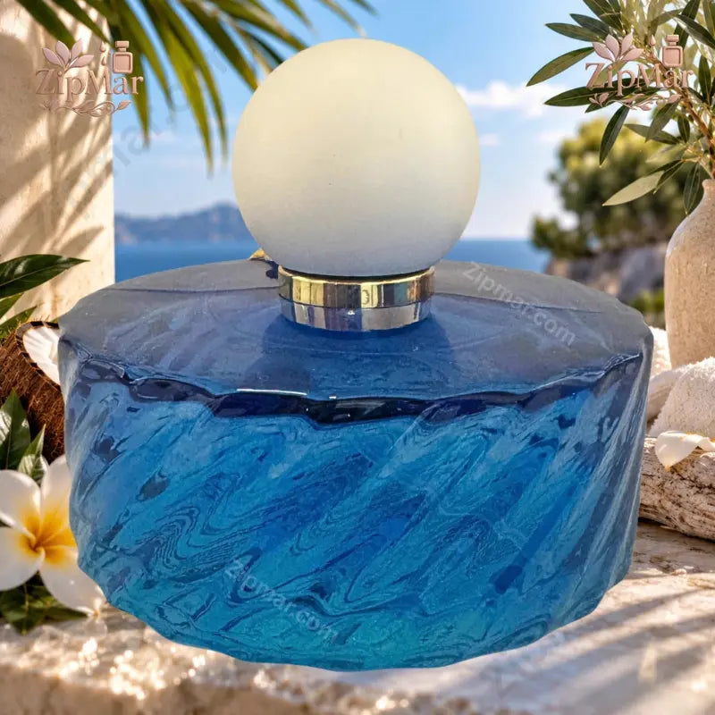 The Scent Club Santorini Sun Eau de Parfum 3.4 oz deep blue wave-textured disc bottle with frosted white ball cap top view