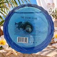 Thumbnail for Bottom of The Scent Club Santorini Sun Eau de Parfum 100 mL bottle showing product label, SKU TGSS01, and UPC barcode