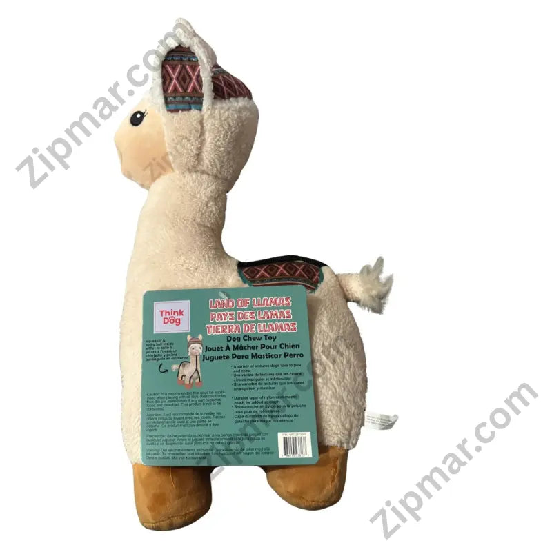 Think Dog Land of Llamas plush llama dog chew toy in boho Andean-styled room with colorful woven rug, macramé, and mountain backdrop