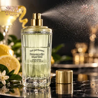 Thumbnail for Tini Perfumes Limoncello Martini Eau de Parfum 3.4 oz actively spraying with gold nozzle and ribbed glass bottle with lemon styling