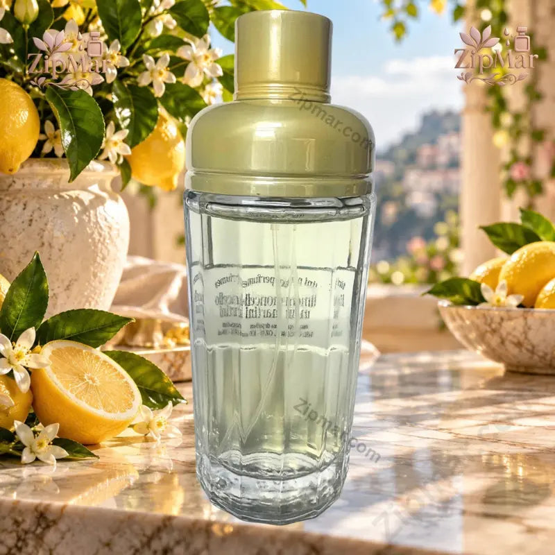 Tini Perfumes Limoncello Martini Eau de Parfum 100 mL ribbed clear glass cocktail shaker bottle with gold dome cap side view with lemons