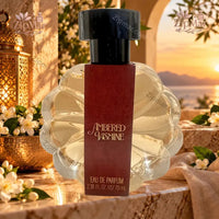 Thumbnail for Tru Fragrance Ambered Jasmine Eau de Parfum 70mL scalloped glass bubble bottle with burgundy label and Moroccan lantern background