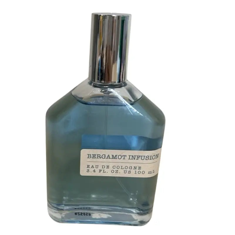 Angle view highlighting the clear blue liquid and silver cap of the Tru Fragrance Bergamot Infusion Men's cologne.