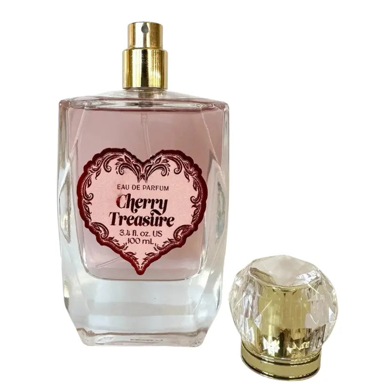 Tru Fragrance Cherry Treasure 3.4 oz Eau de Parfum bottle with the crystalline cap removed showing the gold spray nozzle.